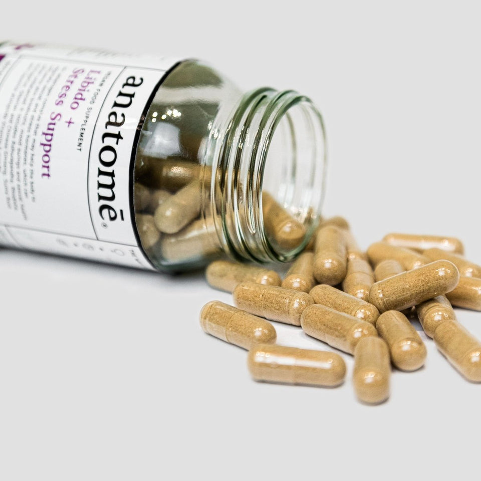 A jar full with a Rhodiola supplement spilling out